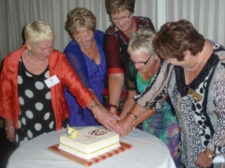 Cutting the cake at the 20 Years celebration